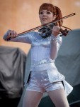 File Photo: Lindsey Stirling in concert in 2015, at the Bunbury Festival in Cincinnati, Ohio. Used by permission. (Photo Credit: Larry Philpot, soundstagephotography.com)