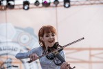 File Photo: Lindsey Stirling in concert in 2015, at the Bunbury Festival in Cincinnati, Ohio. Used by permission. (Photo Credit: Larry Philpot, soundstagephotography.com)