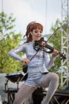 File Photo: Lindsey Stirling in concert in 2015, at the Bunbury Festival in Cincinnati, Ohio. Used by permission. (Photo Credit: Larry Philpot, soundstagephotography.com)