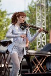 File Photo: Lindsey Stirling in concert in 2015, at the Bunbury Festival in Cincinnati, Ohio. Used by permission. (Photo Credit: Larry Philpot, soundstagephotography.com)