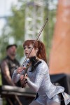 File Photo: Lindsey Stirling in concert in 2015, at the Bunbury Festival in Cincinnati, Ohio. Used by permission. (Photo Credit: Larry Philpot, soundstagephotography.com)