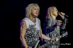 File Photo: Rick Savage and Joe Elliott of Def Leppard performing in Noblesville, Indiiana, 2016. Used with Permission. (Photo Credit: Larry Philpot)